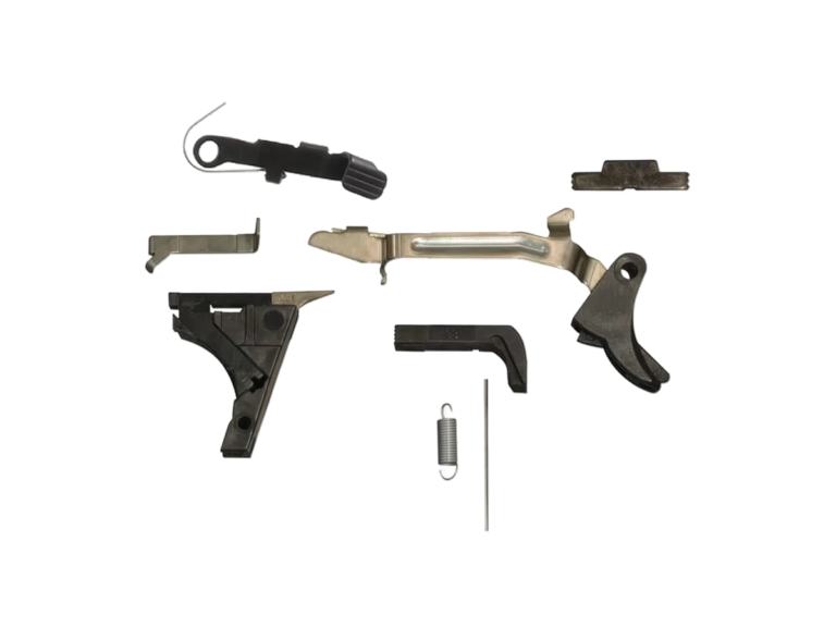 G80 Lower Parts Kit laid out: trigger with trigger bar, trigger housing with ejector, connector, slide lock, slide stop release, magazine release and springs